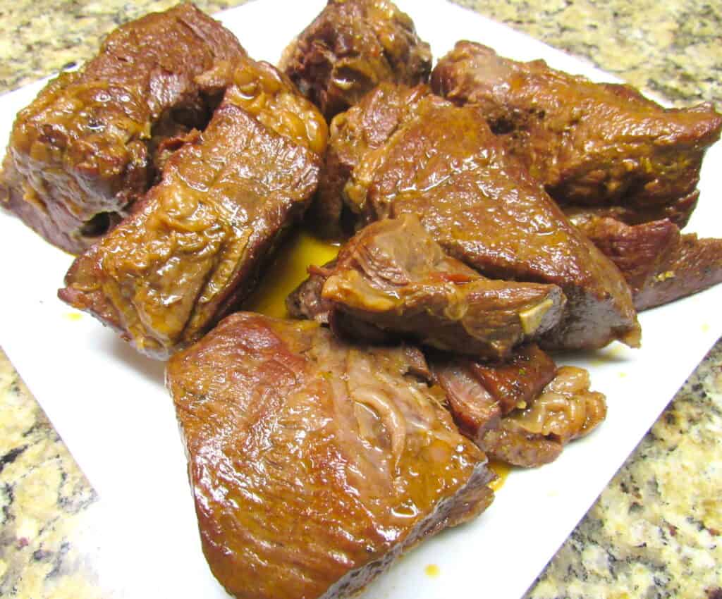 closeup of instant pot roast chunks on white plate