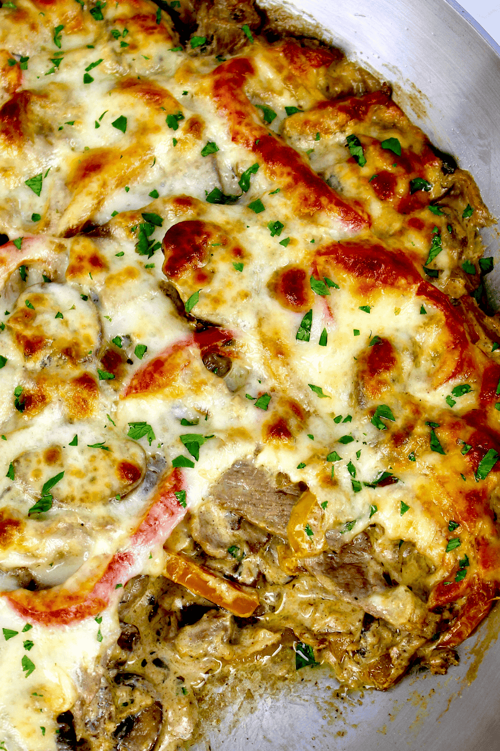 Philly Cheesesteak Casserole with piece missing