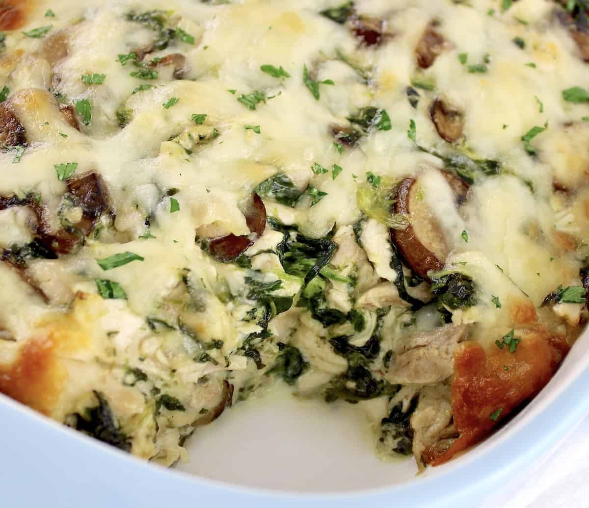closeup of Keto Chicken Florentine Casserole with piece missing