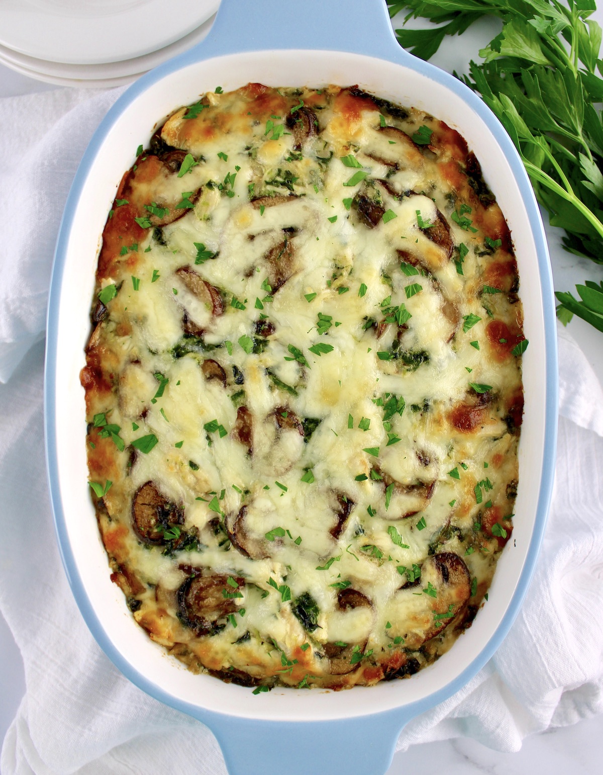 overhead view of Keto Chicken Florentine Casserole with chopped parsley on top