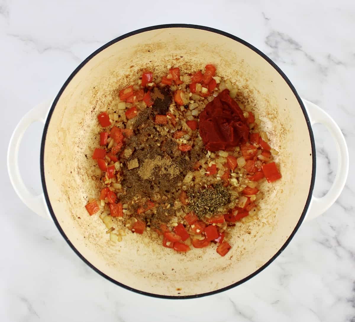 red peppers onions, garlic,spices and tomato paste in skillet