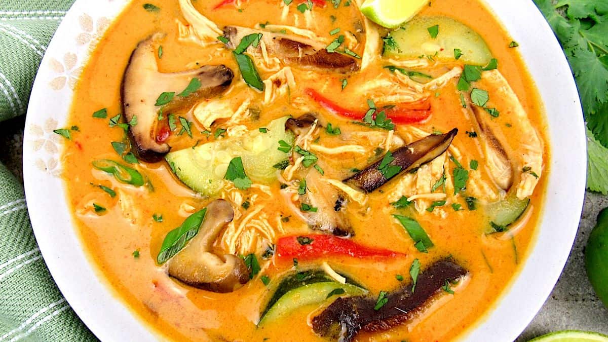 Thai Coconut Curry Chicken Soup closeup with chopped cilantro