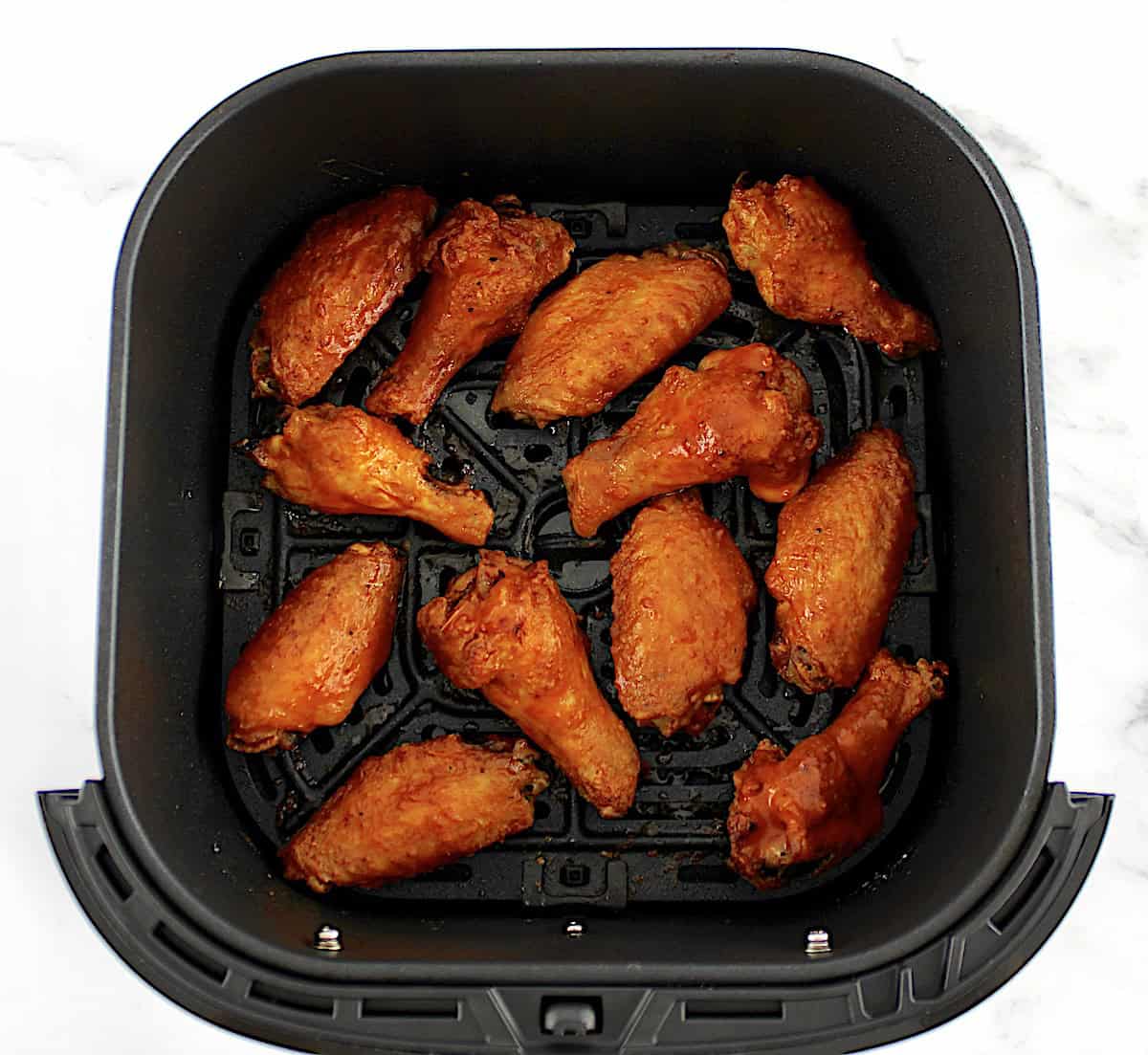 12 buffalo chicken wings in air fryer basket
